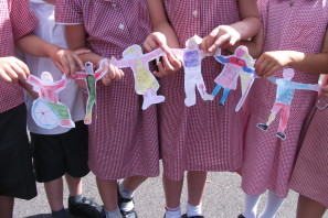 Pupils with their work for Send My Friend To School campaign